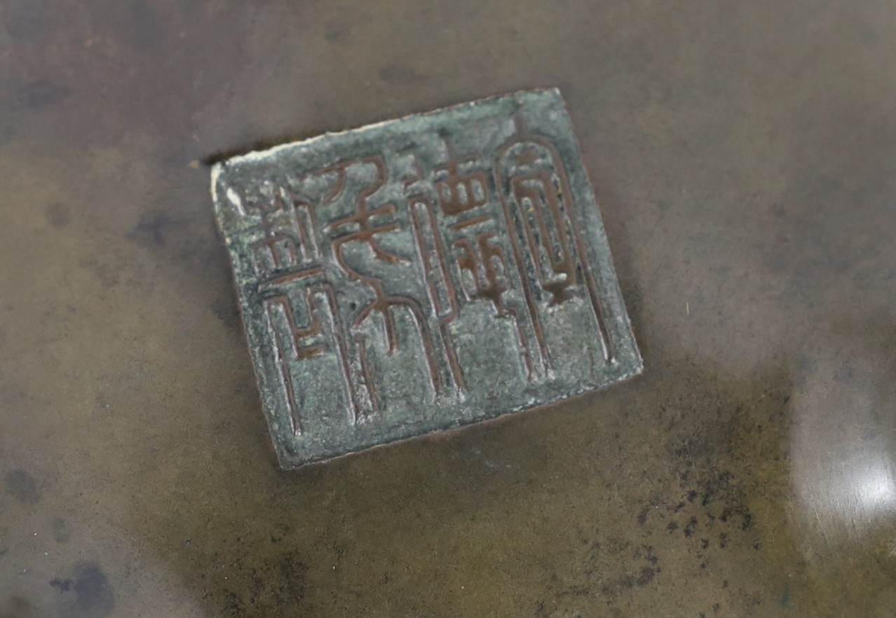 A Chinese bronze censer and stand, ding, 18th/19th century, 18.7cm wide, 11cm high